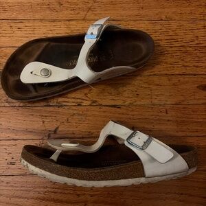 Well loved white Birkenstocks